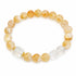 Gold and clear crystal beaded bracelet with round beads and clear faceted cube centerpiece