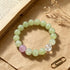 Light green beaded bracelet with lilac bead and clear faceted crystal accent