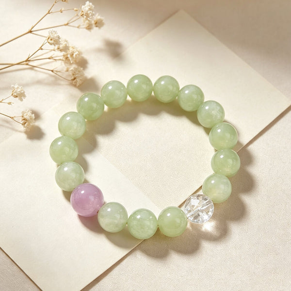 Pastel green beaded bracelet with lilac bead and clear faceted crystal charm